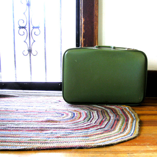 Crochet Rug and Green Vintage Suitcase