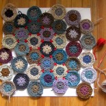 Hexagon wool crochet rug in progress by anneemcgraw